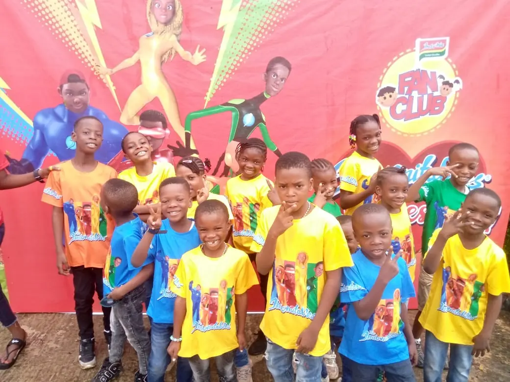 Pupils in colourful T-shirts at a Fan Club event