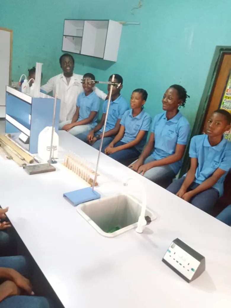 Secondary students seated at a science laboratory bench